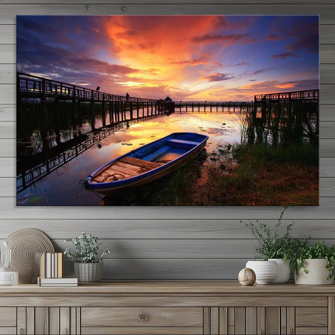 The "Sunset Boat Scene on Lake Triptych" beautifully captures a vibrant sunset over a calm lake. This tranquil scene, featuring serene reflections and surrounded by reeds, is printed on premium giclee canvas with Canon print quality. The gallery wrap design enhances every detail of tranquility.