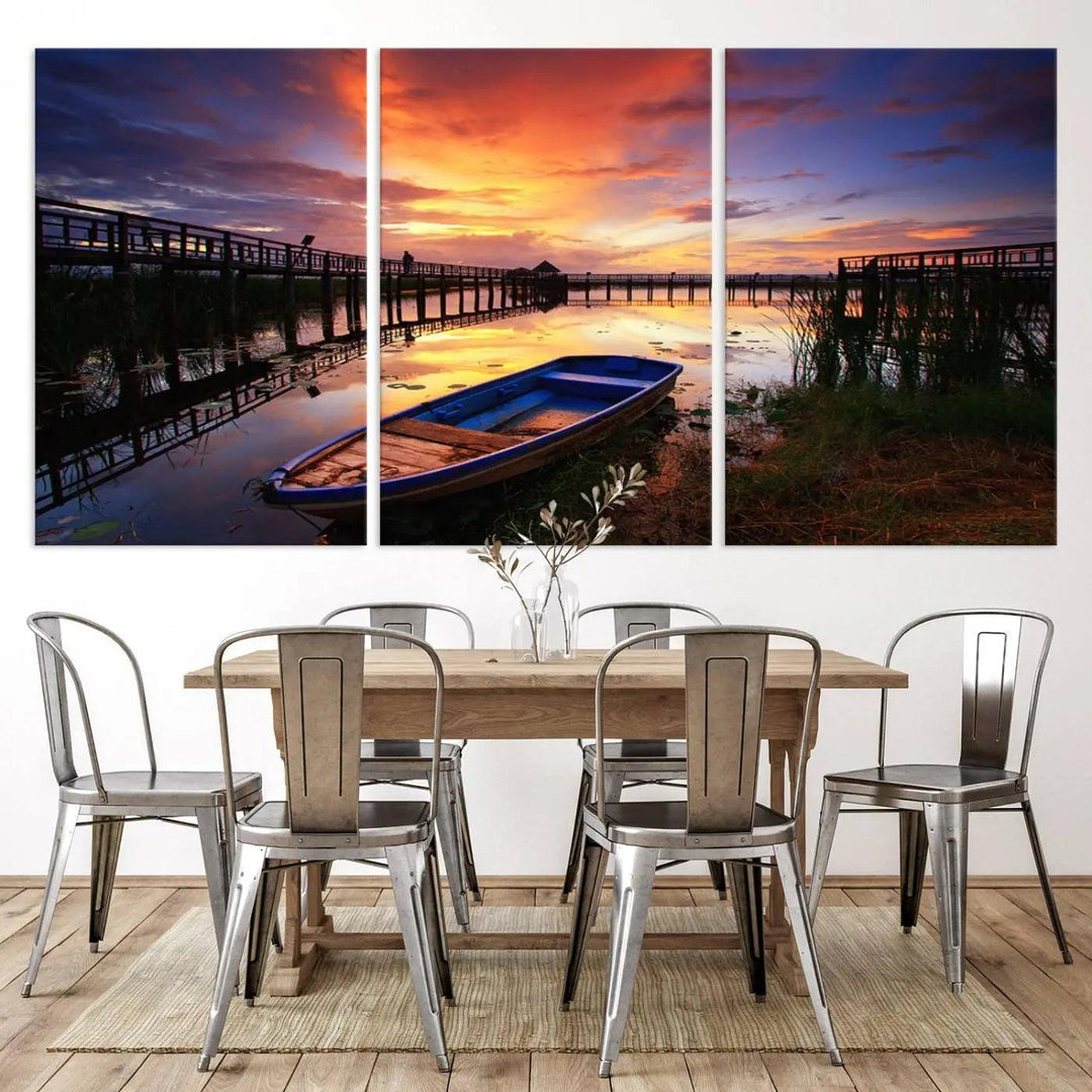 The "Sunset Boat Scene on Lake Triptych" beautifully captures a vibrant sunset over a calm lake. This tranquil scene, featuring serene reflections and surrounded by reeds, is printed on premium giclee canvas with Canon print quality. The gallery wrap design enhances every detail of tranquility.