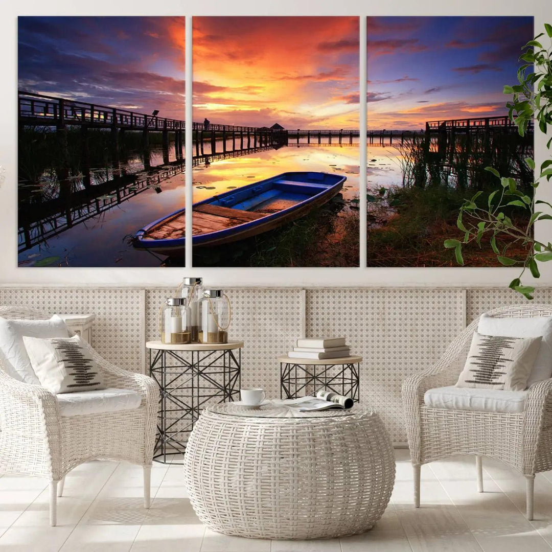 The "Sunset Boat Scene on Lake Triptych" beautifully captures a vibrant sunset over a calm lake. This tranquil scene, featuring serene reflections and surrounded by reeds, is printed on premium giclee canvas with Canon print quality. The gallery wrap design enhances every detail of tranquility.