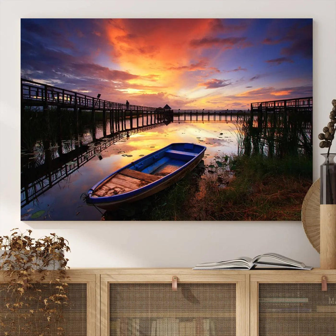 The "Sunset Boat Scene on Lake Triptych" beautifully captures a vibrant sunset over a calm lake. This tranquil scene, featuring serene reflections and surrounded by reeds, is printed on premium giclee canvas with Canon print quality. The gallery wrap design enhances every detail of tranquility.