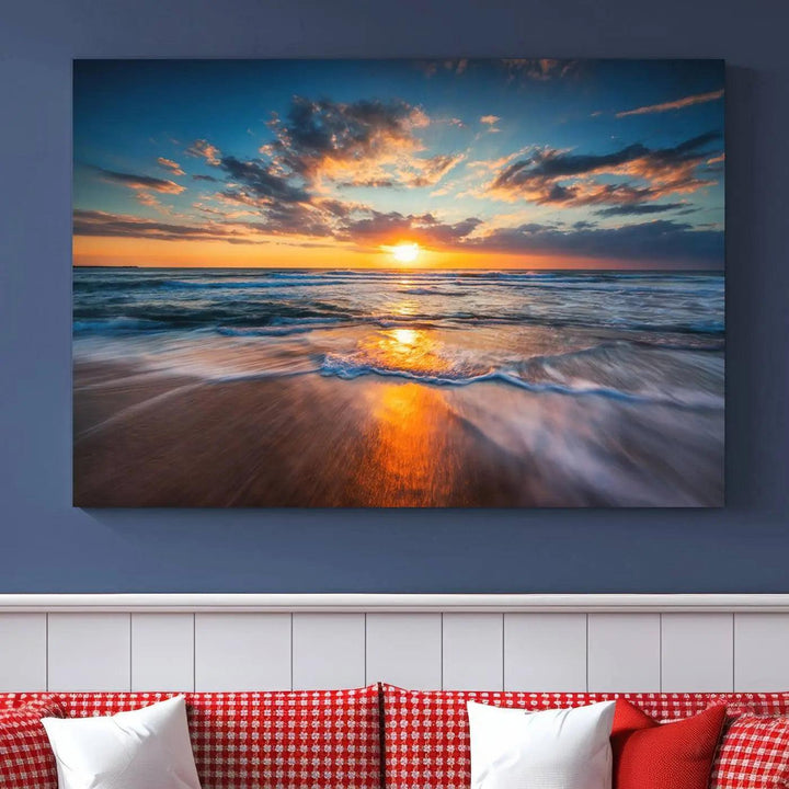 A triptych of "Sunset on the Ocean Beach with Waves," a vibrant coastal wall art print, showcases reflections on the sand during an ocean sunset.