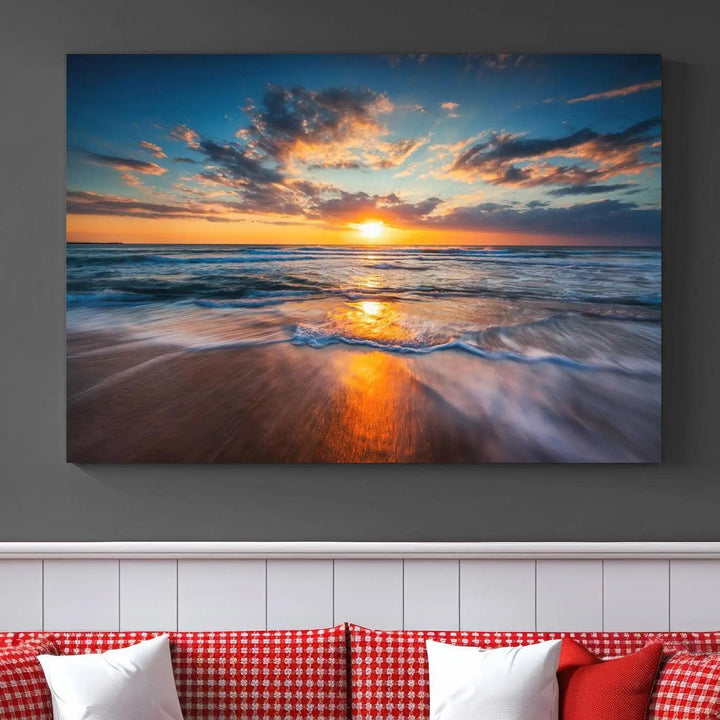 A triptych of "Sunset on the Ocean Beach with Waves," a vibrant coastal wall art print, showcases reflections on the sand during an ocean sunset.