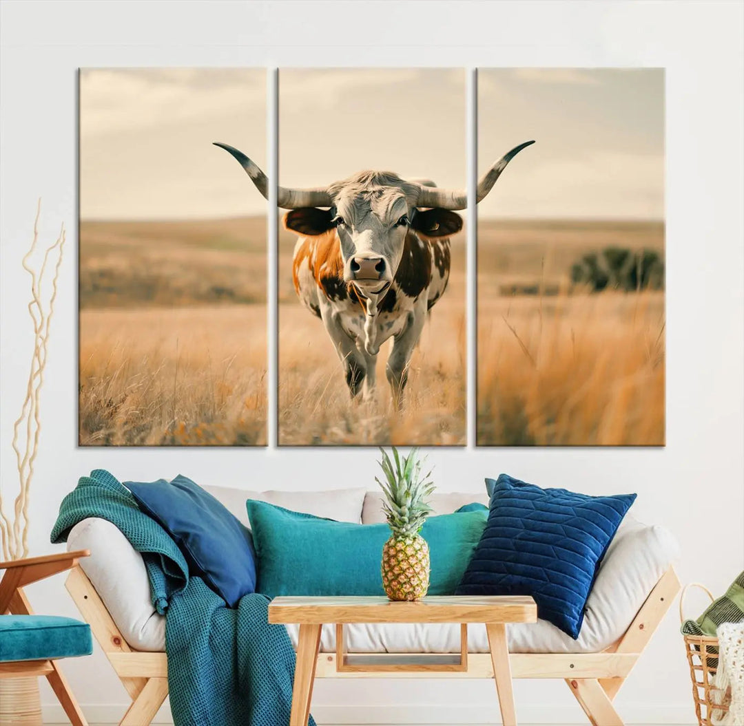 The Texas Cow Wall Art Canvas Print enhances the space with its depiction of a Texas cow in a field, adding charm to the area.