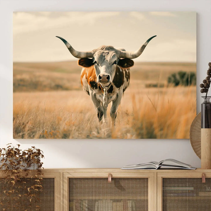 The Texas Cow Wall Art Canvas Print enhances the space with its depiction of a Texas cow in a field, adding charm to the area.