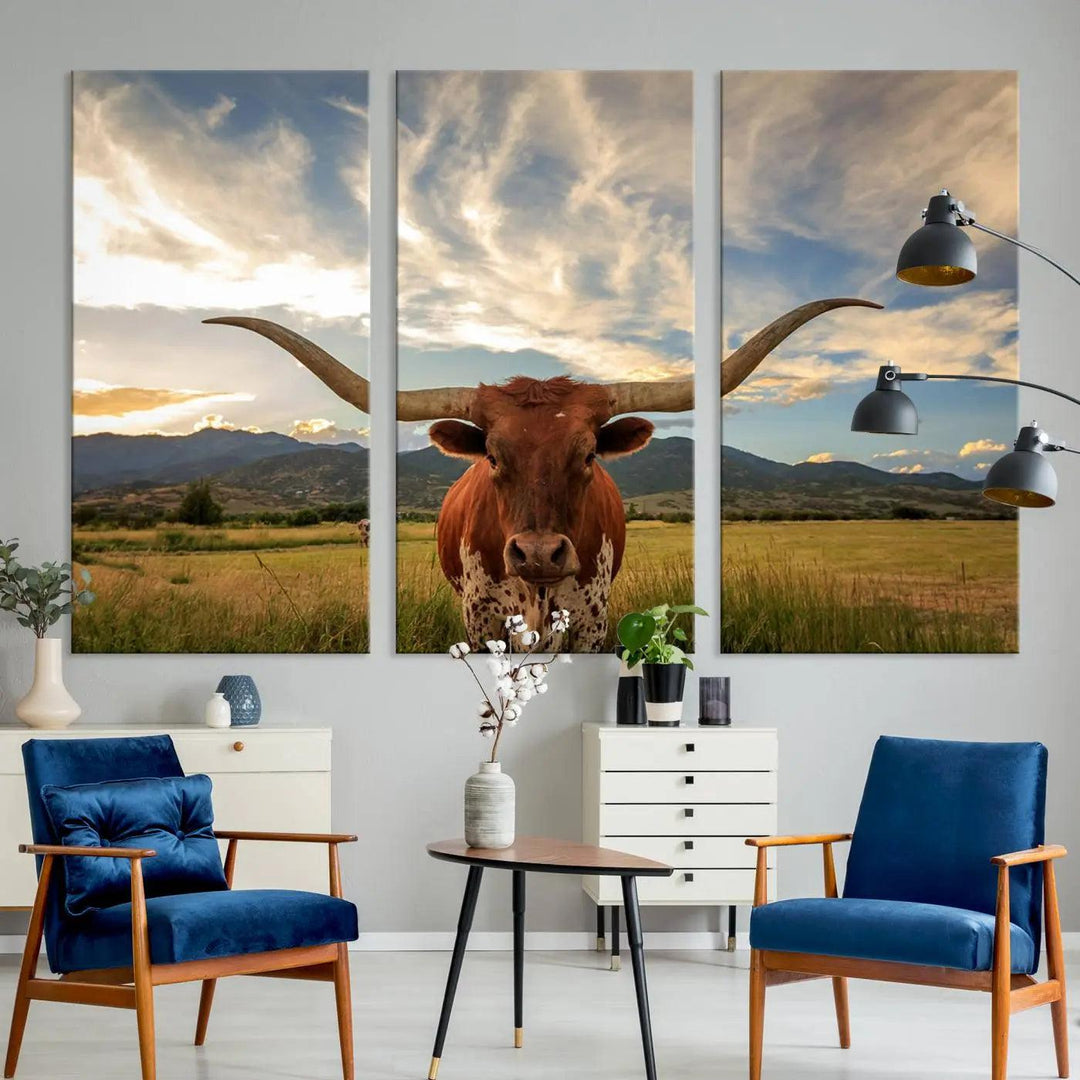 The Texas Longhorn Canvas Wall Art showcases a majestic longhorn steer in a field encircled by mountains under a cloudy sky. Ideal for enthusiasts of rustic western decor, this piece beautifully captures the essence of majestic triptych animal print.