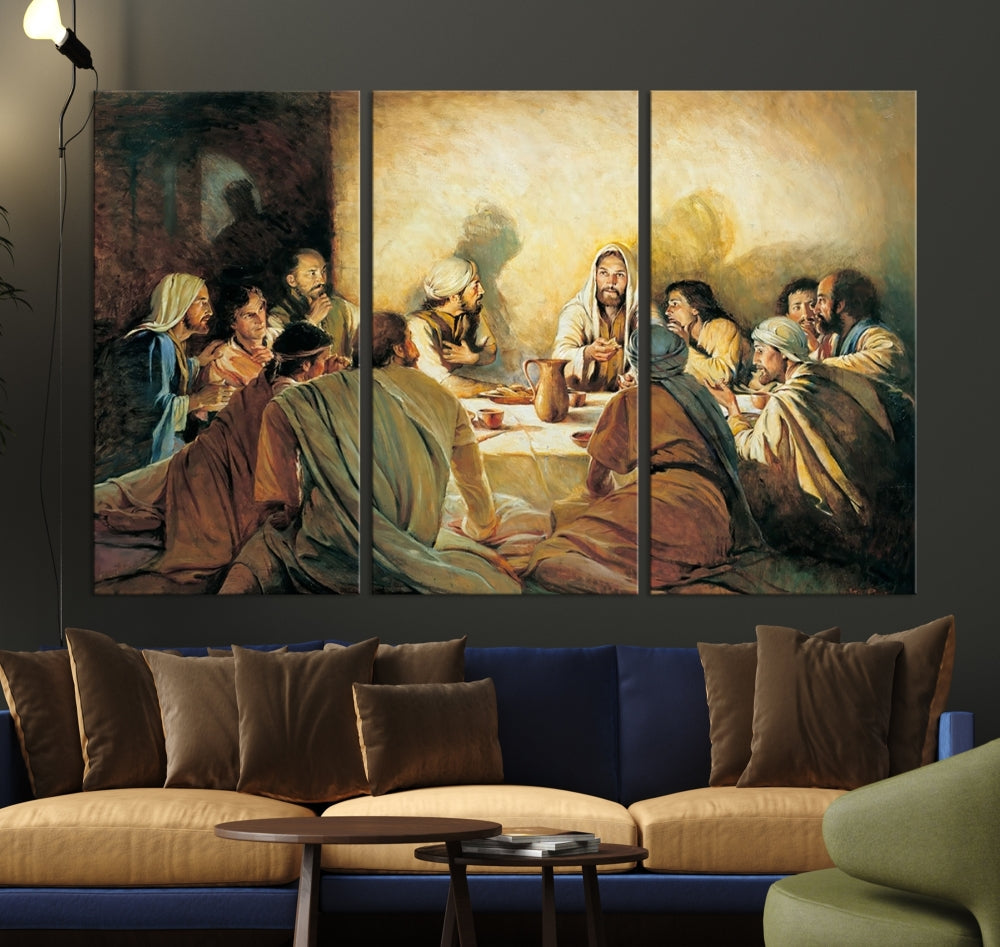 A cozy living room showcases a three-panel canvas titled "The Last Supper Canvas Wall Art – Sacred Religious Masterpiece," depicting people gathered at a table reminiscent of the Last Supper.