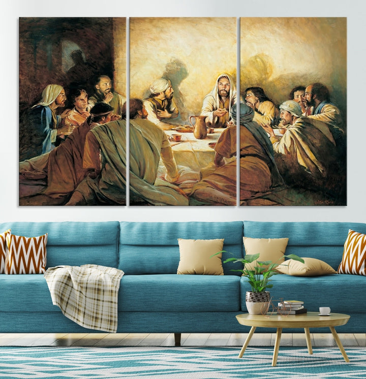 A cozy living room showcases a three-panel canvas titled "The Last Supper Canvas Wall Art – Sacred Religious Masterpiece," depicting people gathered at a table reminiscent of the Last Supper.