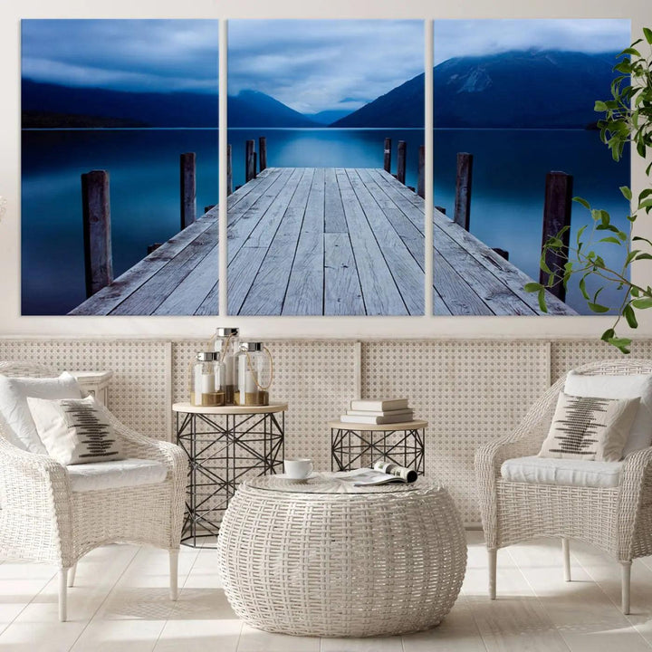 Tranquil lakeside pier triptych canvas art featuring a blue mountain horizon and serene dock. Perfect for modern interiors. High-quality giclee canvas print.