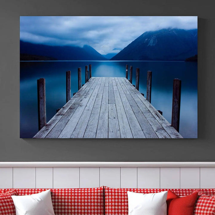 Tranquil lakeside pier triptych canvas art featuring a blue mountain horizon and serene dock. Perfect for modern interiors. High-quality giclee canvas print.