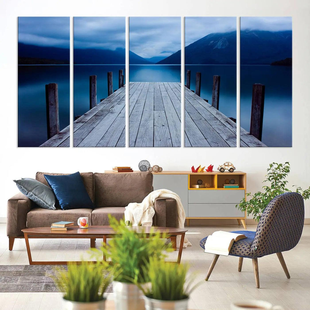 Tranquil lakeside pier triptych canvas art featuring a blue mountain horizon and serene dock. Perfect for modern interiors. High-quality giclee canvas print.