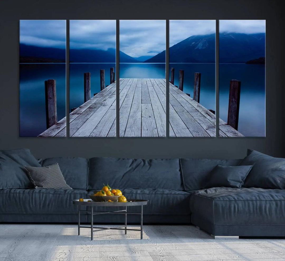 Tranquil lakeside pier triptych canvas art featuring a blue mountain horizon and serene dock. Perfect for modern interiors. High-quality giclee canvas print.