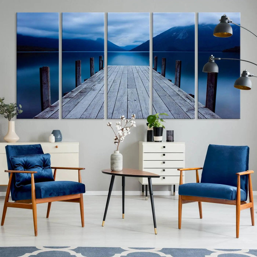 Tranquil lakeside pier triptych canvas art featuring a blue mountain horizon and serene dock. Perfect for modern interiors. High-quality giclee canvas print.