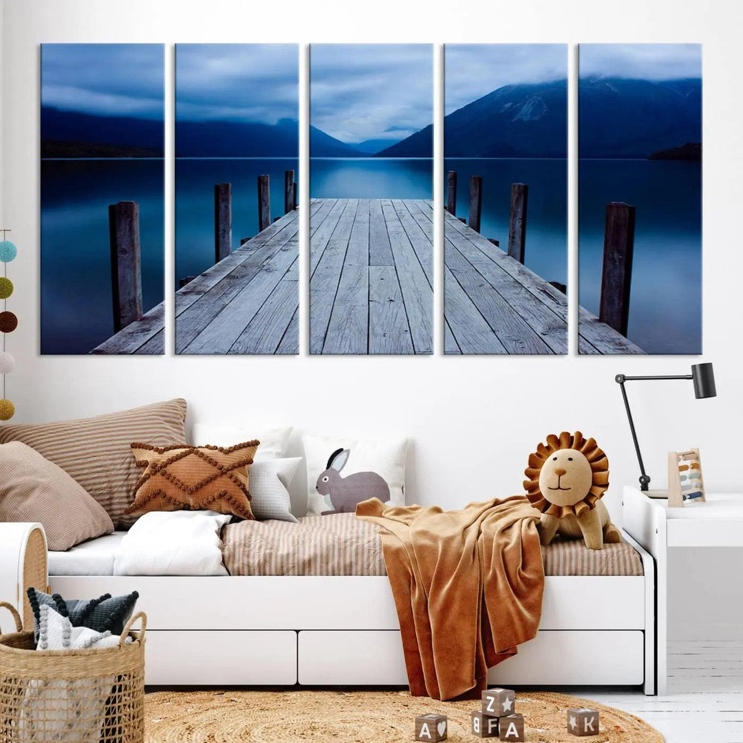 Tranquil lakeside pier triptych canvas art featuring a blue mountain horizon and serene dock. Perfect for modern interiors. High-quality giclee canvas print.