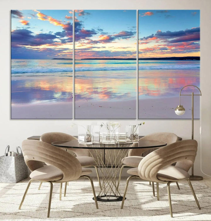 A modern living room is accentuated by a stunning Tranquil Pastel Sunset Beach Triptych Canvas Art on the wall, epitomizing coastal home decor elegance.