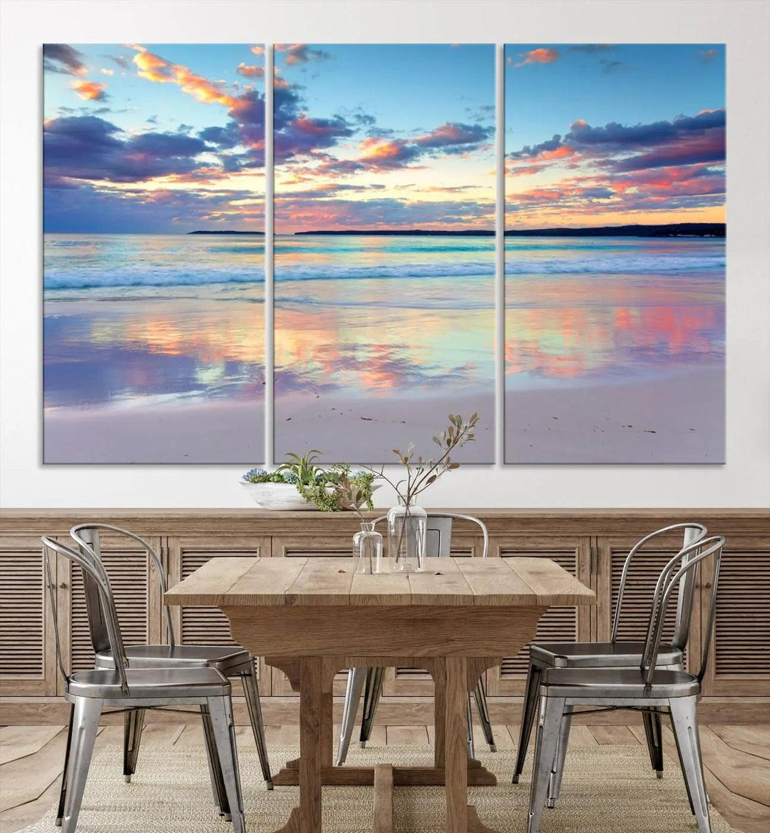 A modern living room is accentuated by a stunning Tranquil Pastel Sunset Beach Triptych Canvas Art on the wall, epitomizing coastal home decor elegance.