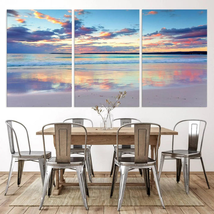 A modern living room is accentuated by a stunning Tranquil Pastel Sunset Beach Triptych Canvas Art on the wall, epitomizing coastal home decor elegance.