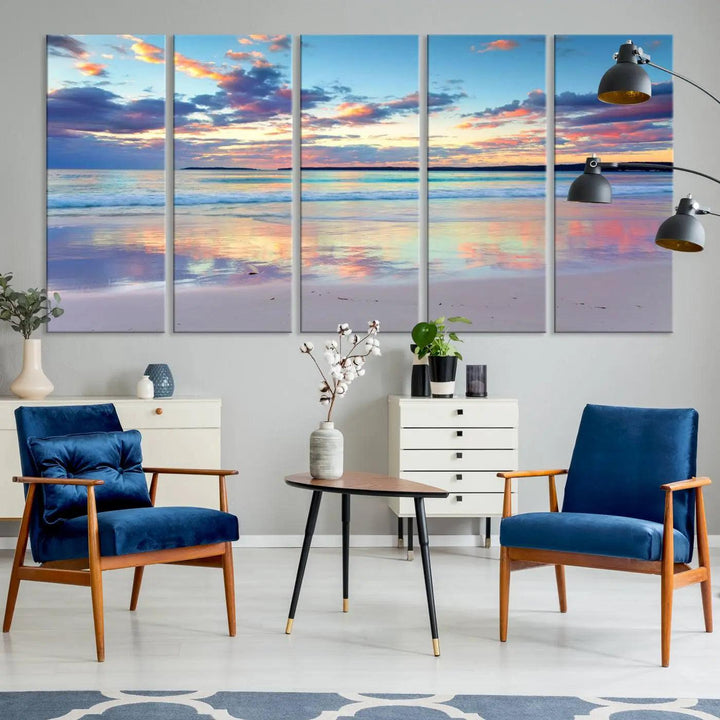 A modern living room is accentuated by a stunning Tranquil Pastel Sunset Beach Triptych Canvas Art on the wall, epitomizing coastal home decor elegance.