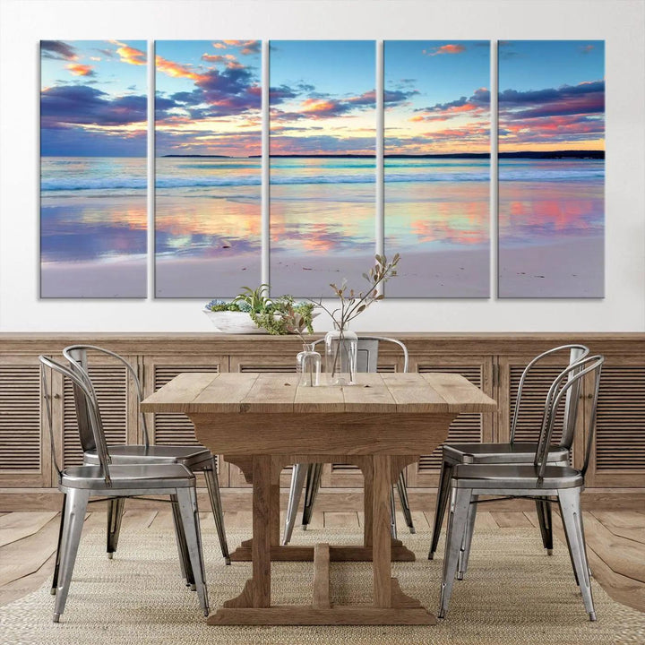 A modern living room is accentuated by a stunning Tranquil Pastel Sunset Beach Triptych Canvas Art on the wall, epitomizing coastal home decor elegance.