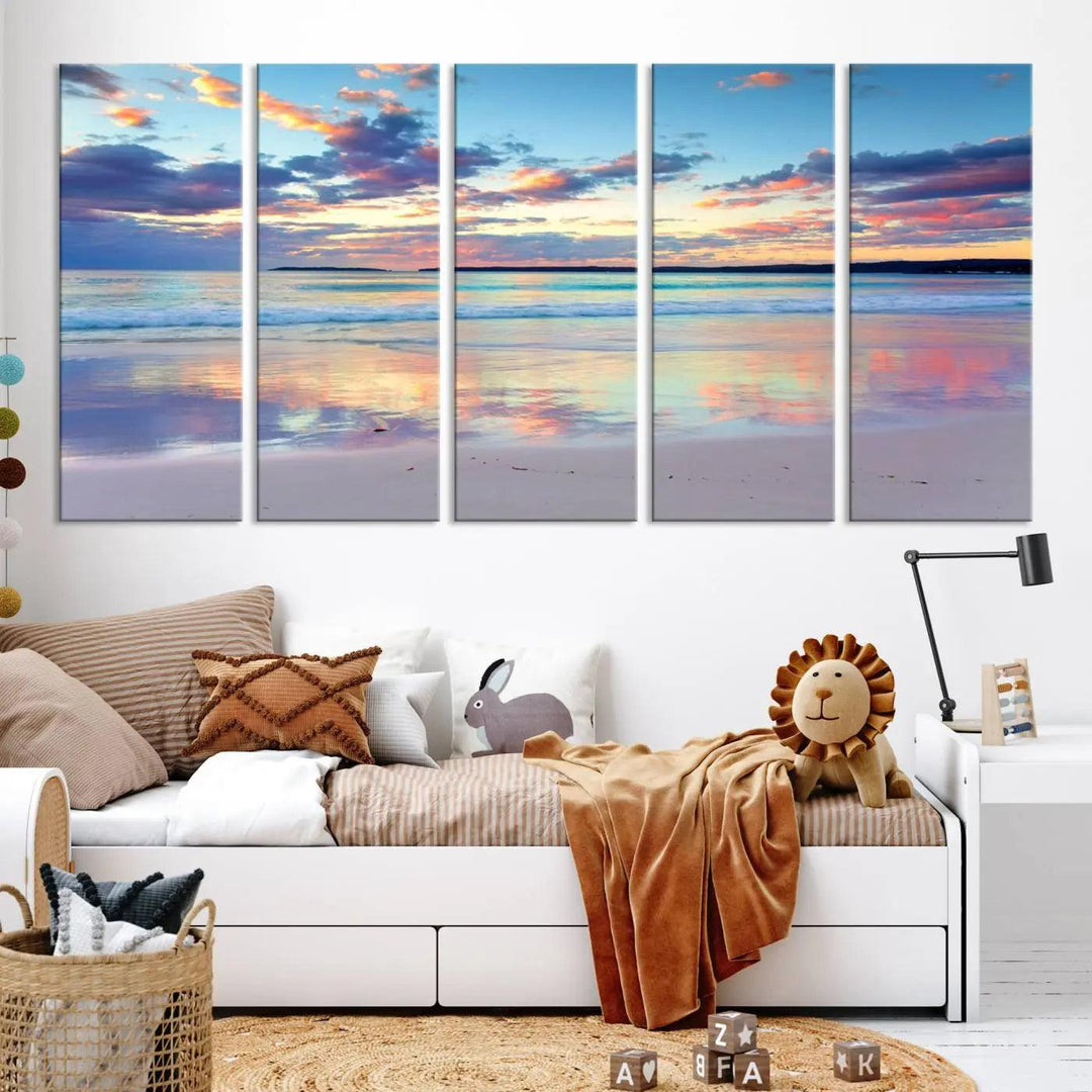 A modern living room is accentuated by a stunning Tranquil Pastel Sunset Beach Triptych Canvas Art on the wall, epitomizing coastal home decor elegance.