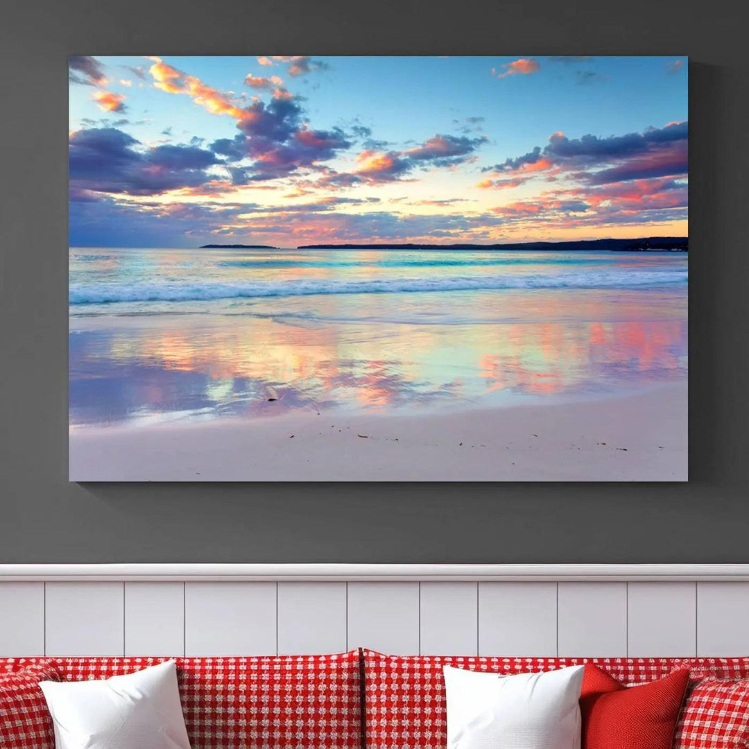 A modern living room is accentuated by a stunning Tranquil Pastel Sunset Beach Triptych Canvas Art on the wall, epitomizing coastal home decor elegance.