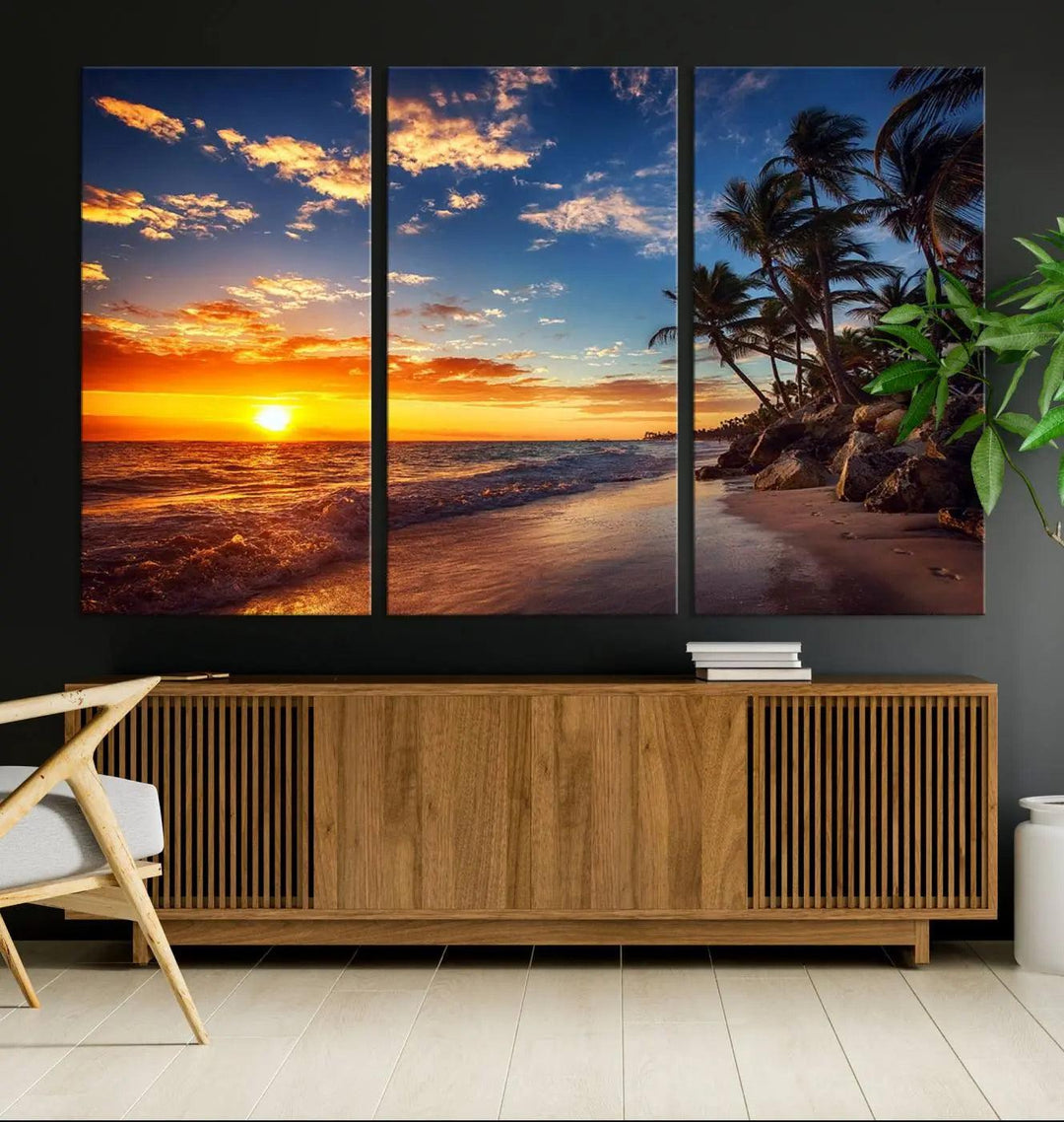 The Tropical Beach Sunset Canvas Art, featuring palm trees and ocean waves, brings an inviting atmosphere to coastal-themed homes.