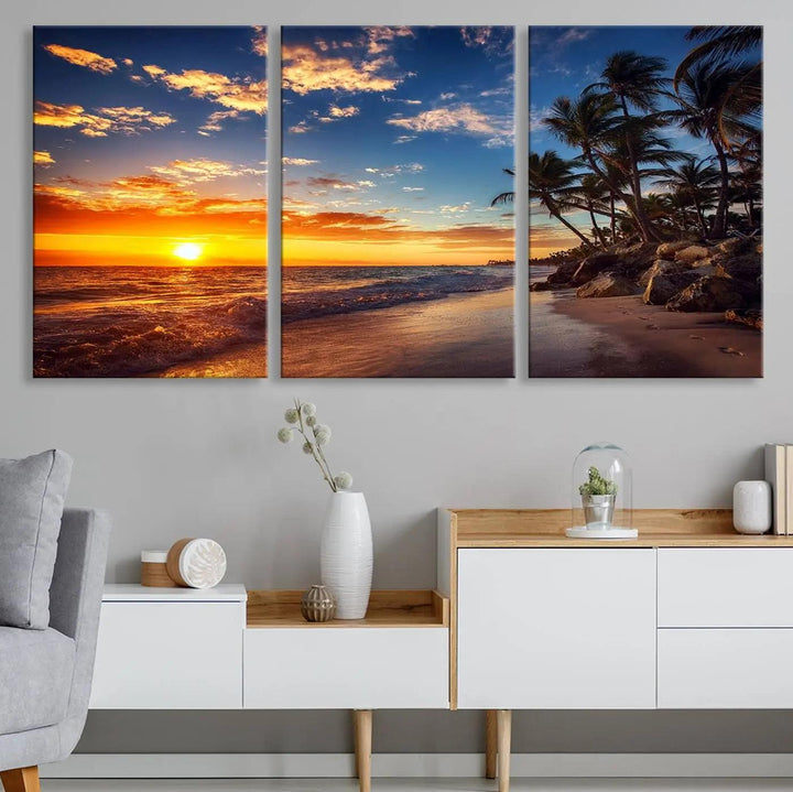 The Tropical Beach Sunset Canvas Art, featuring palm trees and ocean waves, brings an inviting atmosphere to coastal-themed homes.