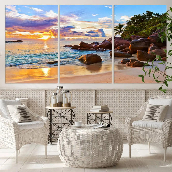 Tropical beach sunset canvas print featuring ocean waves and rocky shoreline. Coastal decor printed on giclee canvas with high-quality Canon print technology.