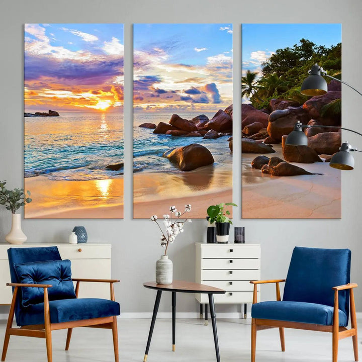 Tropical beach sunset canvas print featuring ocean waves and rocky shoreline. Coastal decor printed on giclee canvas with high-quality Canon print technology.