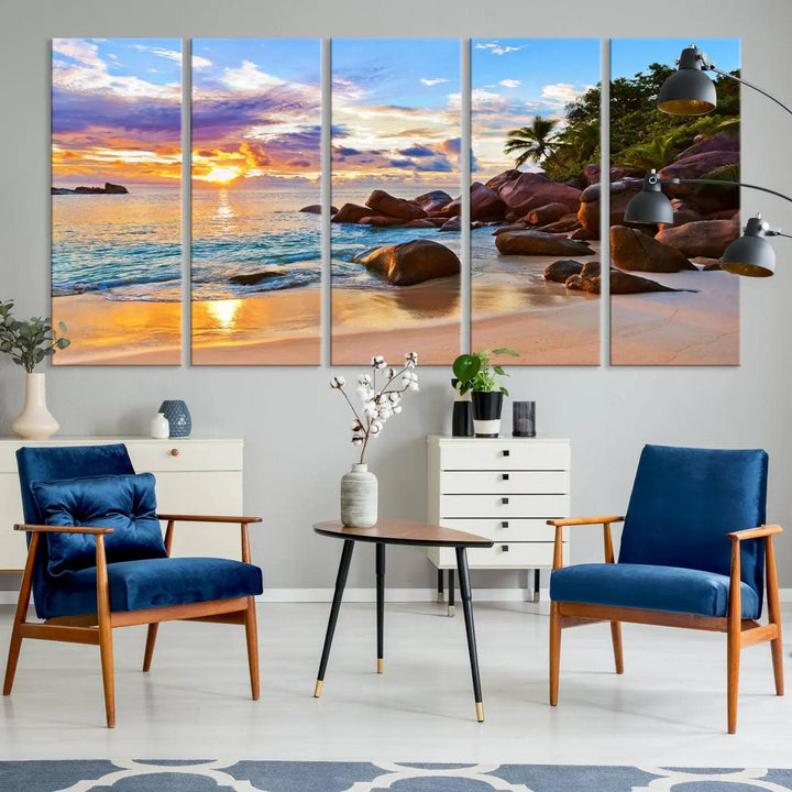 Tropical beach sunset canvas print featuring ocean waves and rocky shoreline. Coastal decor printed on giclee canvas with high-quality Canon print technology.