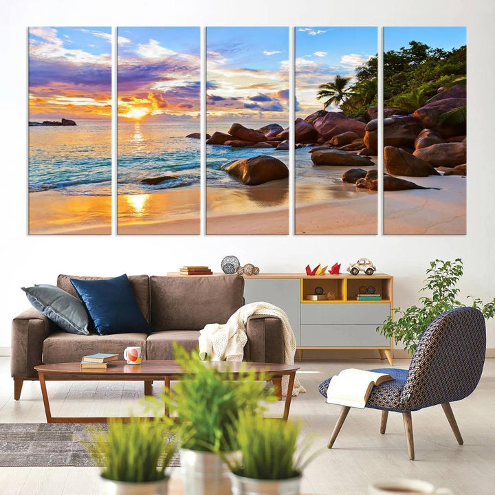 Tropical beach sunset canvas print featuring ocean waves and rocky shoreline. Coastal decor printed on giclee canvas with high-quality Canon print technology.