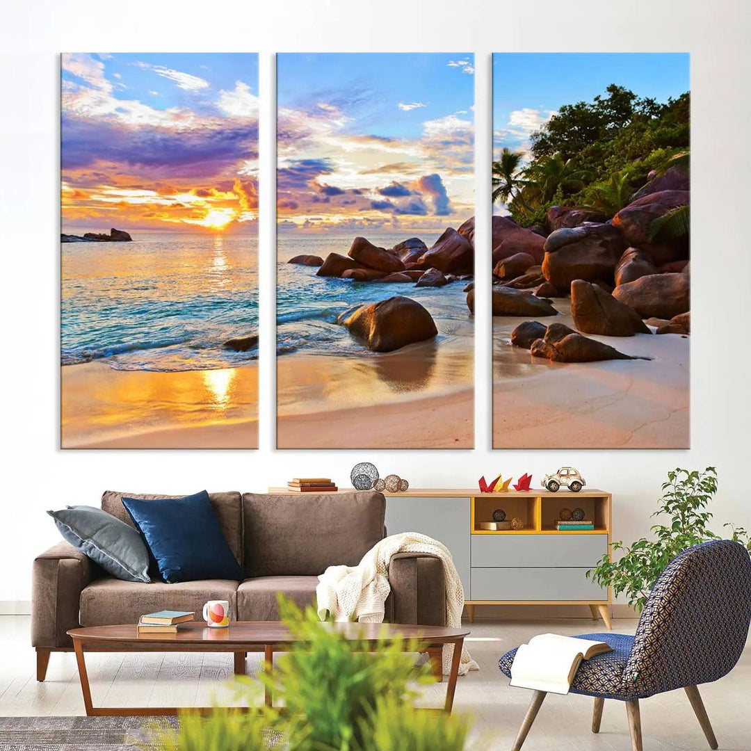 Tropical beach sunset canvas print featuring ocean waves and rocky shoreline. Coastal decor printed on giclee canvas with high-quality Canon print technology.