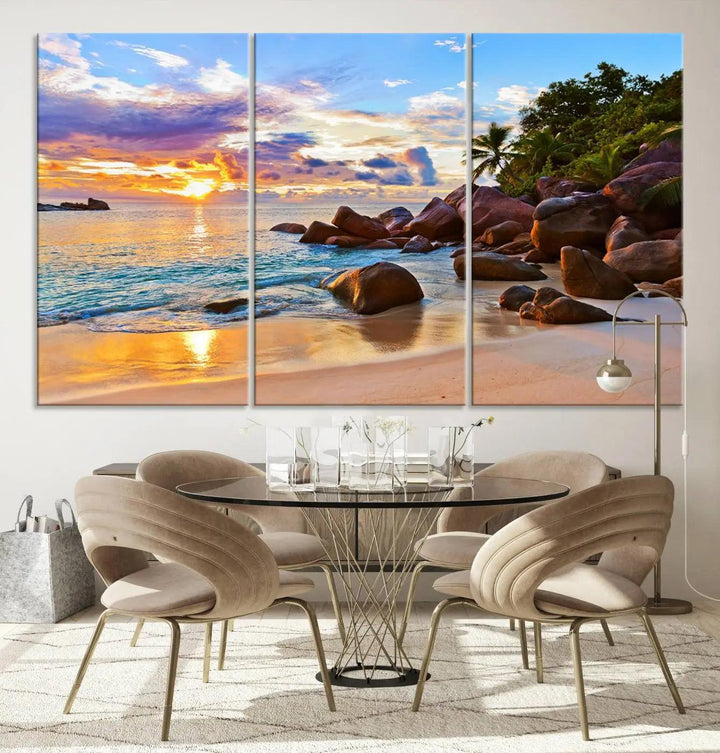 Tropical beach sunset canvas print featuring ocean waves and rocky shoreline. Coastal decor printed on giclee canvas with high-quality Canon print technology.