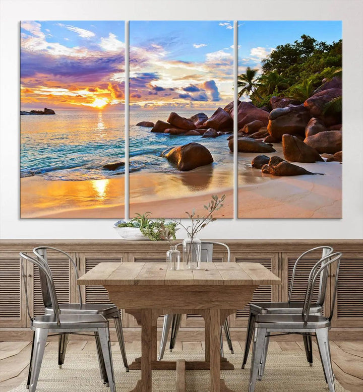 Tropical beach sunset canvas print featuring ocean waves and rocky shoreline. Coastal decor printed on giclee canvas with high-quality Canon print technology.