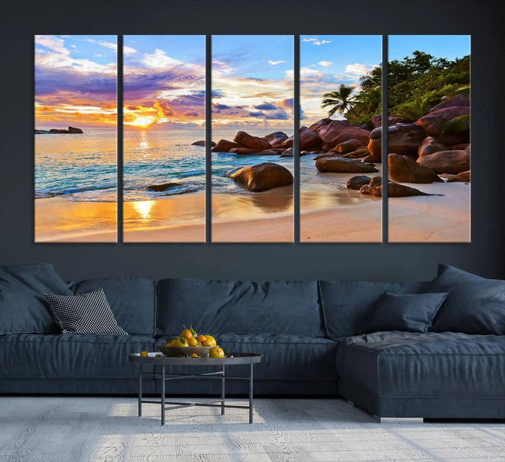 Tropical beach sunset canvas print featuring ocean waves and rocky shoreline. Coastal decor printed on giclee canvas with high-quality Canon print technology.