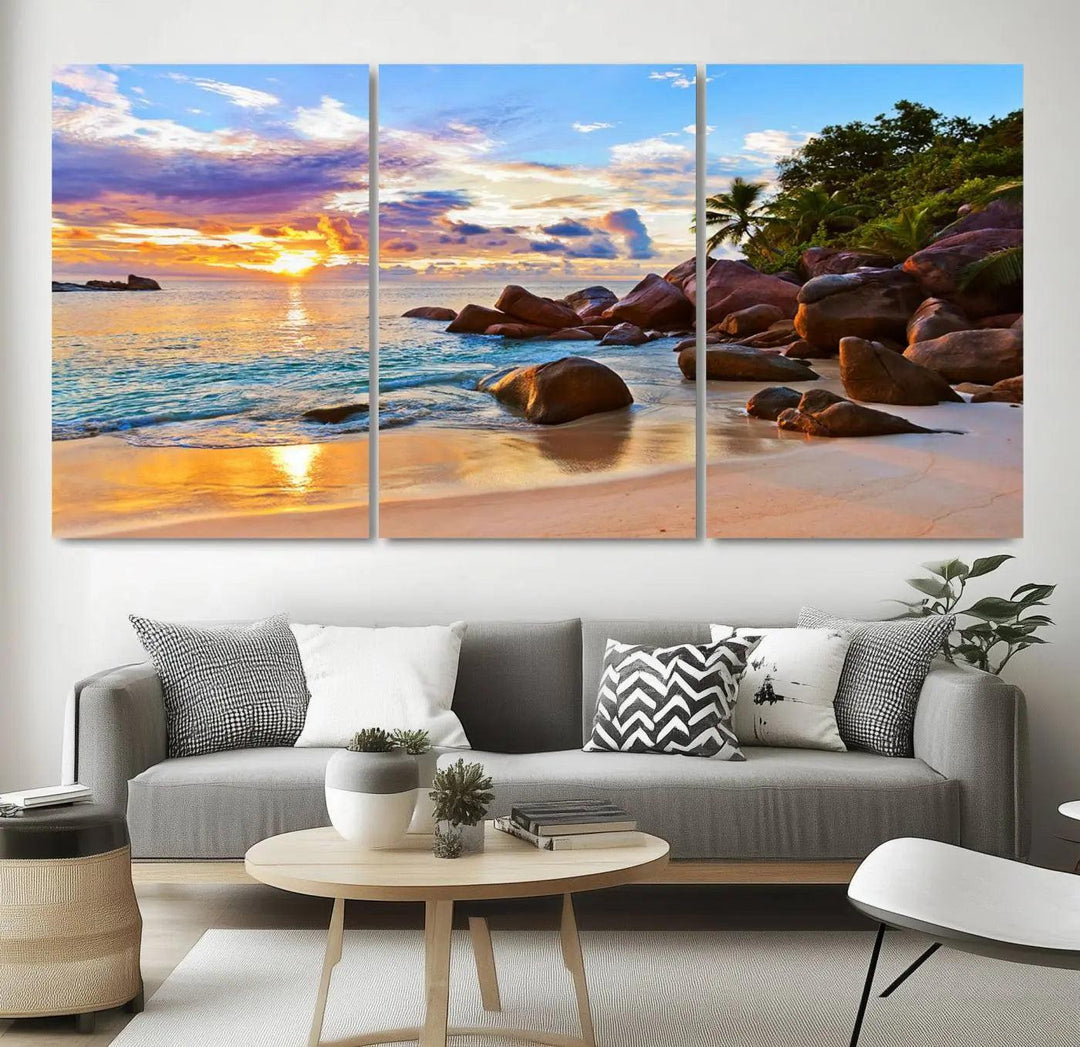 Tropical beach sunset canvas print featuring ocean waves and rocky shoreline. Coastal decor printed on giclee canvas with high-quality Canon print technology.