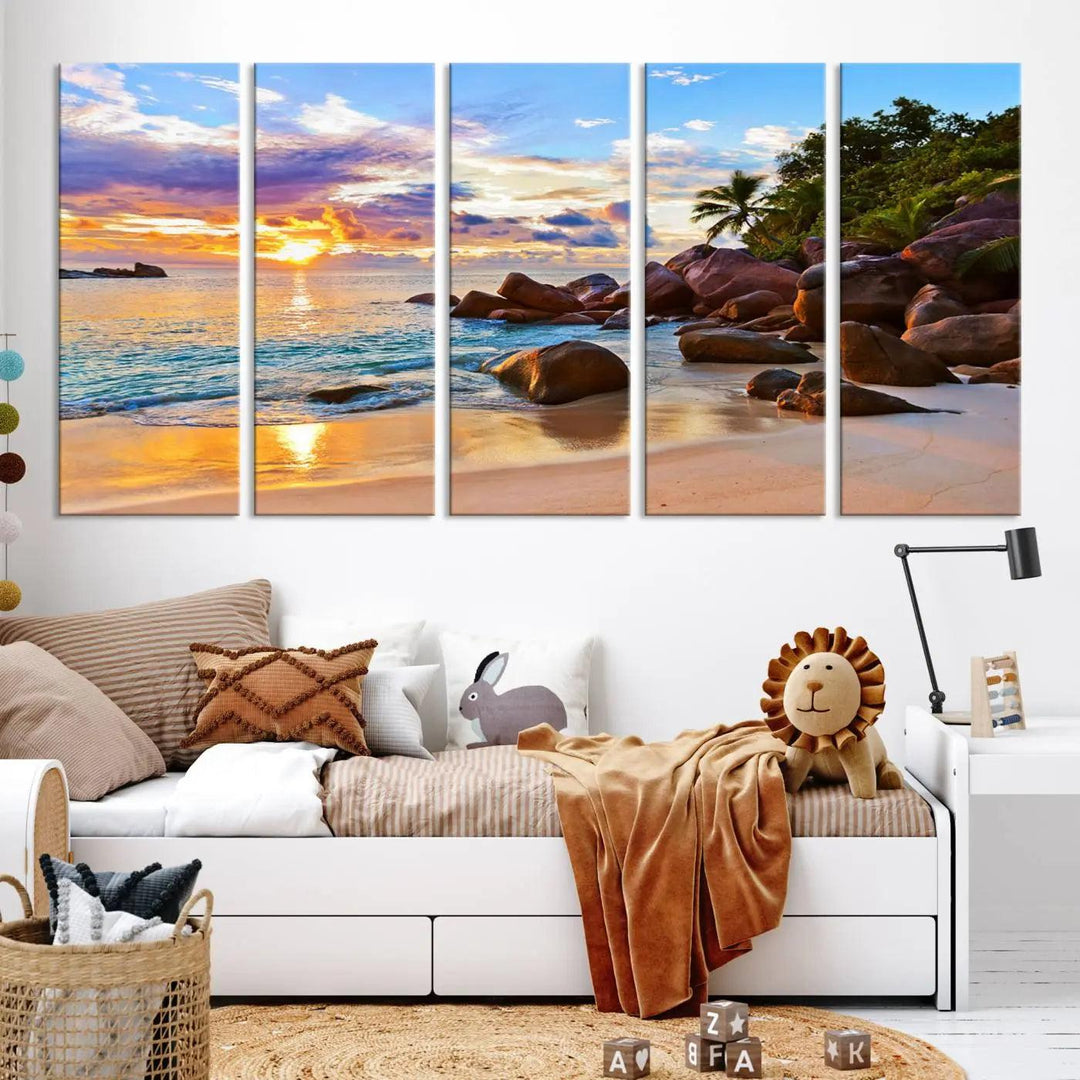 Tropical beach sunset canvas print featuring ocean waves and rocky shoreline. Coastal decor printed on giclee canvas with high-quality Canon print technology.