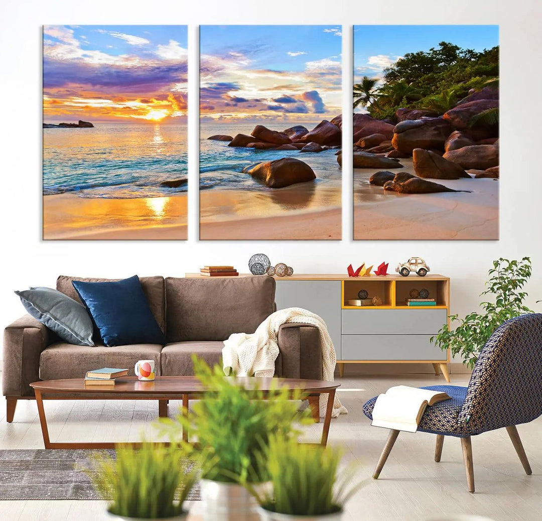 Tropical beach sunset canvas print featuring ocean waves and rocky shoreline. Coastal decor printed on giclee canvas with high-quality Canon print technology.