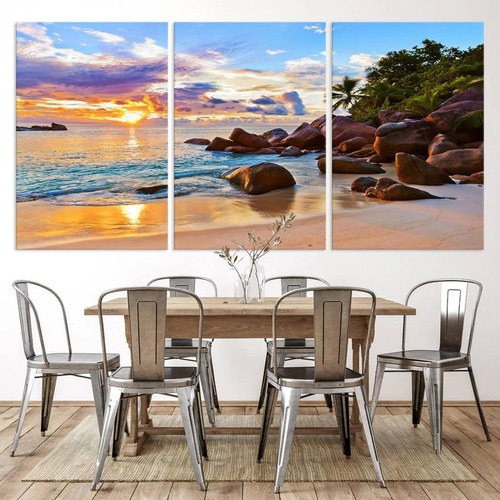 Tropical beach sunset canvas print featuring ocean waves and rocky shoreline. Coastal decor printed on giclee canvas with high-quality Canon print technology.