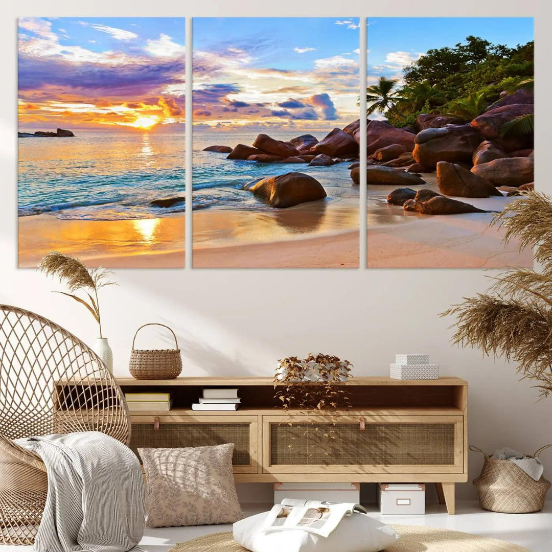 Tropical beach sunset canvas print featuring ocean waves and rocky shoreline. Coastal decor printed on giclee canvas with high-quality Canon print technology.