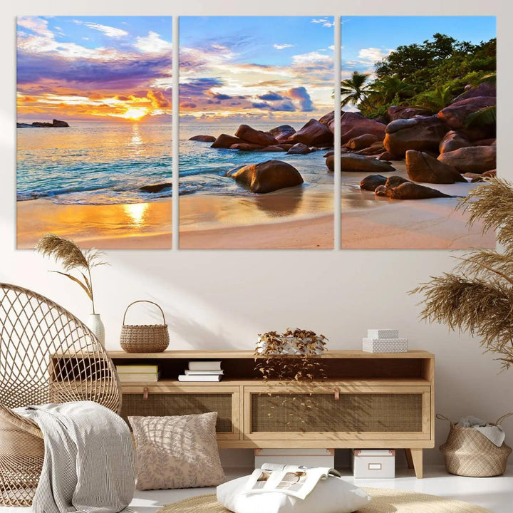 Tropical beach sunset canvas print featuring ocean waves and rocky shoreline. Coastal decor printed on giclee canvas with high-quality Canon print technology.