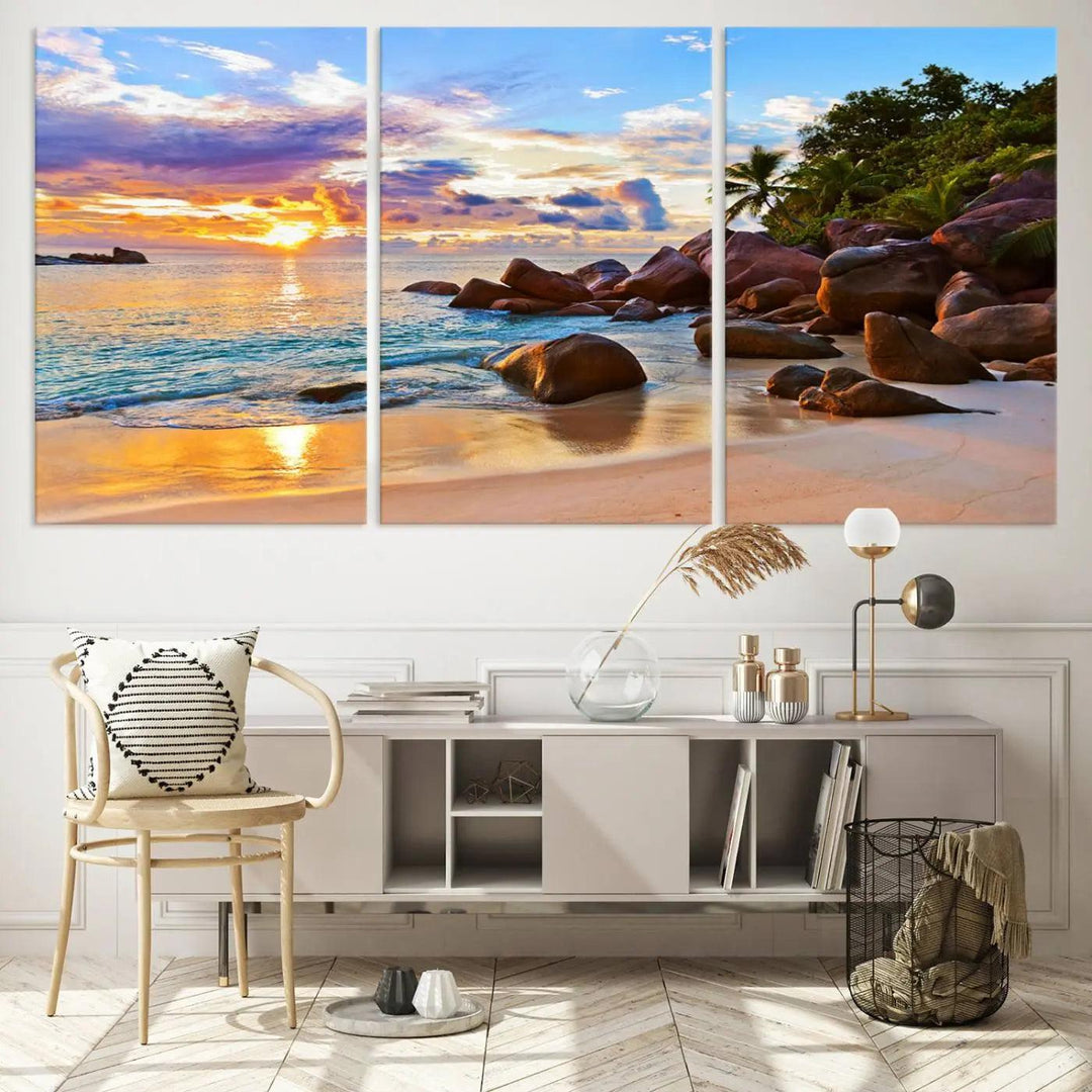 Tropical beach sunset canvas print featuring ocean waves and rocky shoreline. Coastal decor printed on giclee canvas with high-quality Canon print technology.