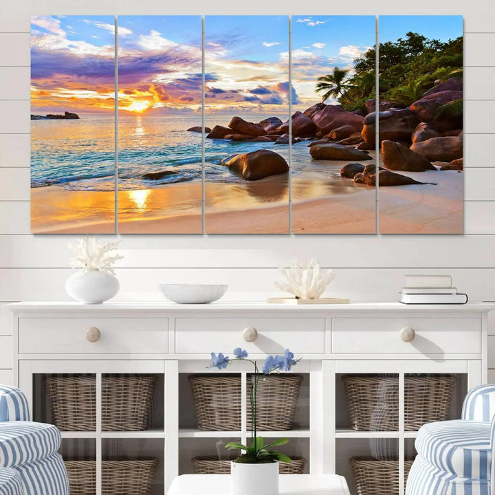 Tropical beach sunset canvas print featuring ocean waves and rocky shoreline. Coastal decor printed on giclee canvas with high-quality Canon print technology.