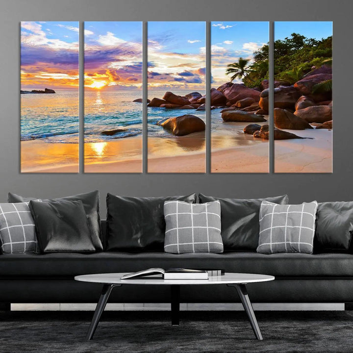 Tropical beach sunset canvas print featuring ocean waves and rocky shoreline. Coastal decor printed on giclee canvas with high-quality Canon print technology.