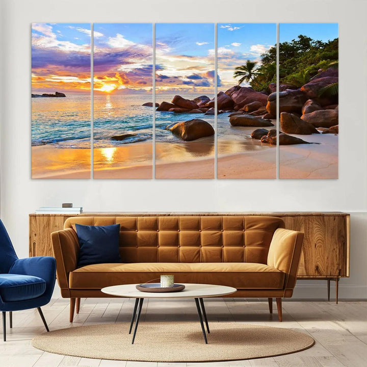 Tropical beach sunset canvas print featuring ocean waves and rocky shoreline. Coastal decor printed on giclee canvas with high-quality Canon print technology.