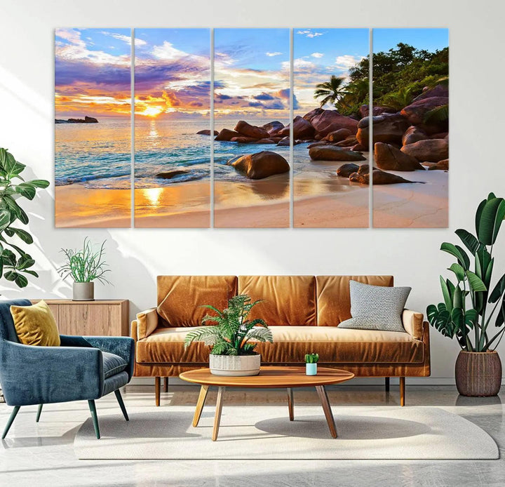 Tropical beach sunset canvas print featuring ocean waves and rocky shoreline. Coastal decor printed on giclee canvas with high-quality Canon print technology.