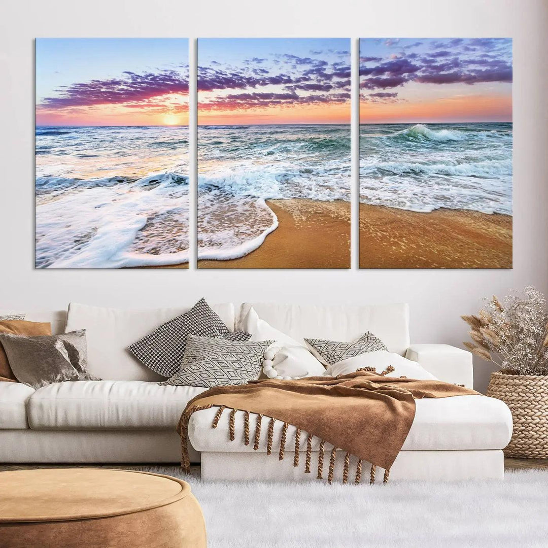 A triptych canvas wall art featuring the Tropical Beach Waves Art Print with a sunset ocean seascape adds striking beauty and perfectly complements the modern living room’s coastal decor.