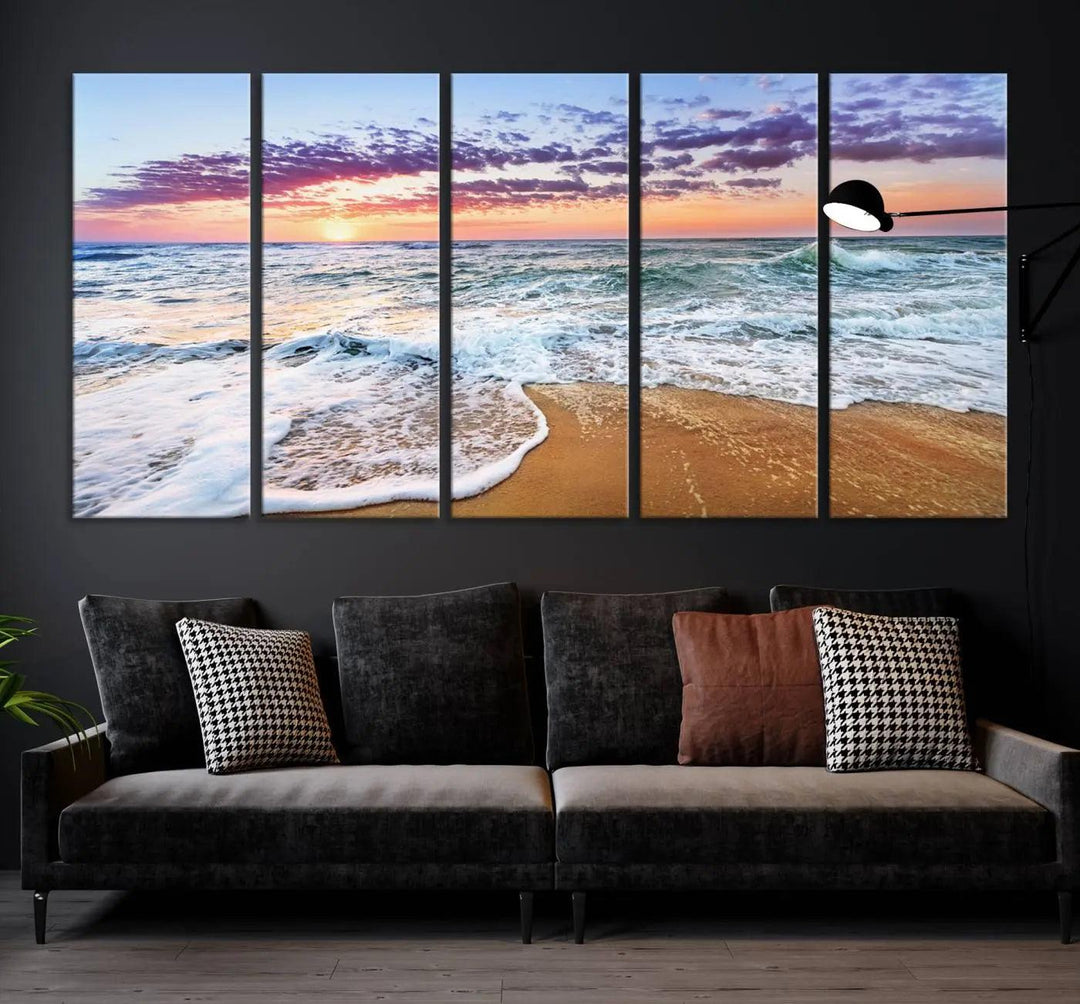 A triptych canvas wall art featuring the Tropical Beach Waves Art Print with a sunset ocean seascape adds striking beauty and perfectly complements the modern living room’s coastal decor.