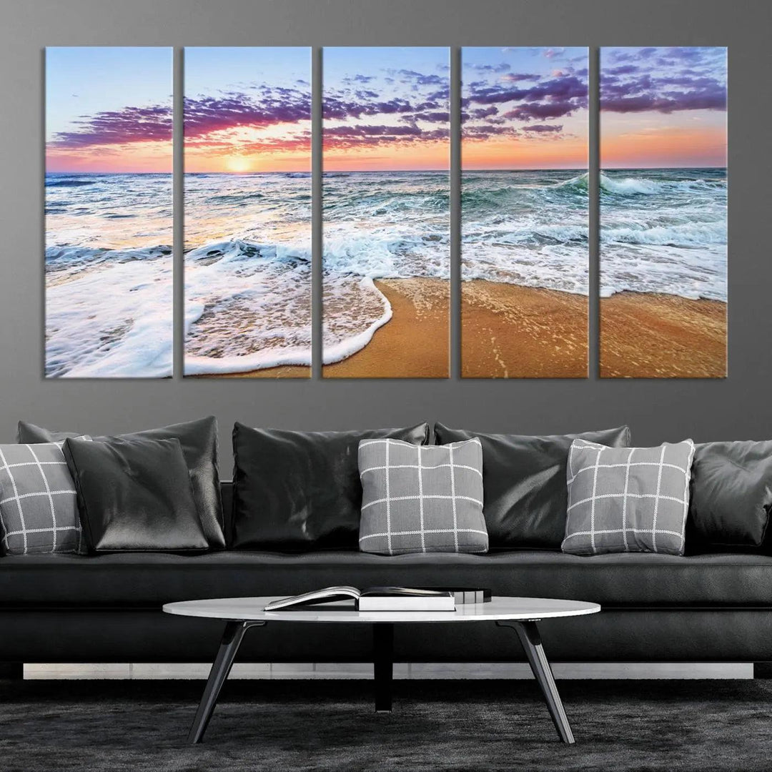 A triptych canvas wall art featuring the Tropical Beach Waves Art Print with a sunset ocean seascape adds striking beauty and perfectly complements the modern living room’s coastal decor.