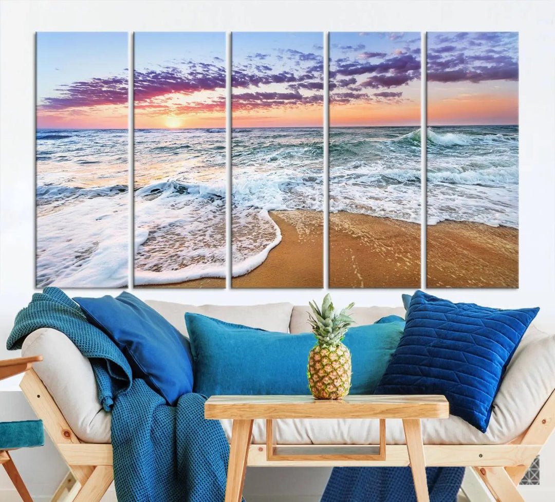 A triptych canvas wall art featuring the Tropical Beach Waves Art Print with a sunset ocean seascape adds striking beauty and perfectly complements the modern living room’s coastal decor.