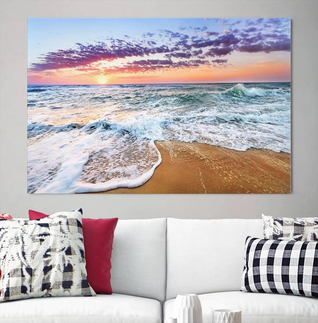 A triptych canvas wall art featuring the Tropical Beach Waves Art Print with a sunset ocean seascape adds striking beauty and perfectly complements the modern living room’s coastal decor.